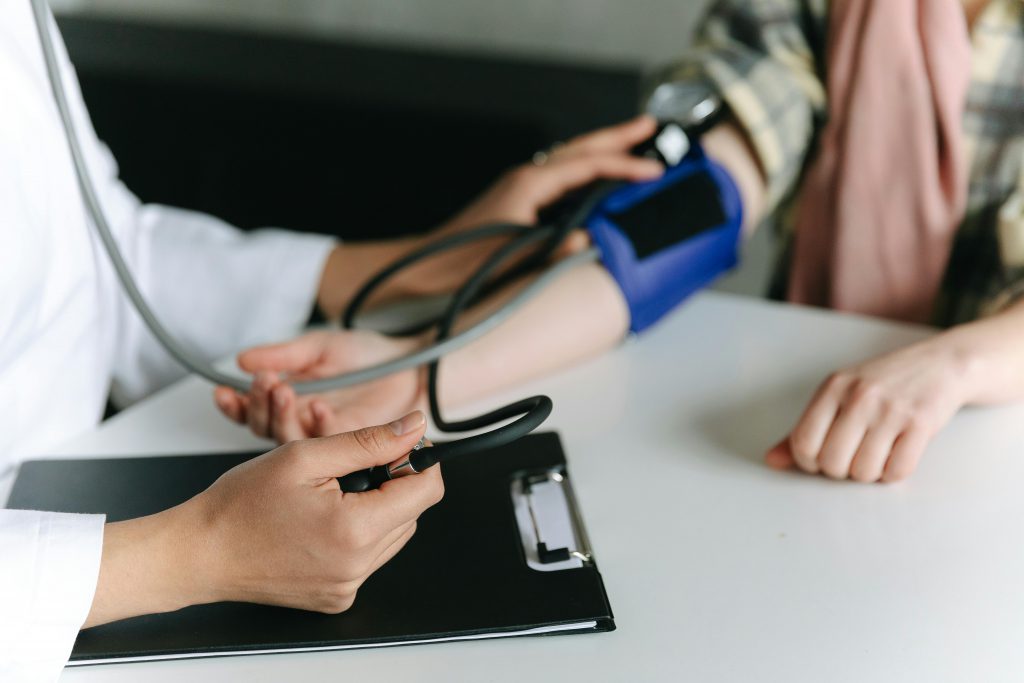 Close-up of a medical professional measuring a patient