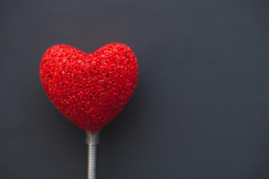 Cardiac Stent Surgery A vibrant red heart on a dark backdrop, symbolizing love and romance.